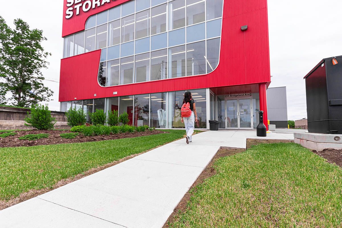 Student walking into storage facility
